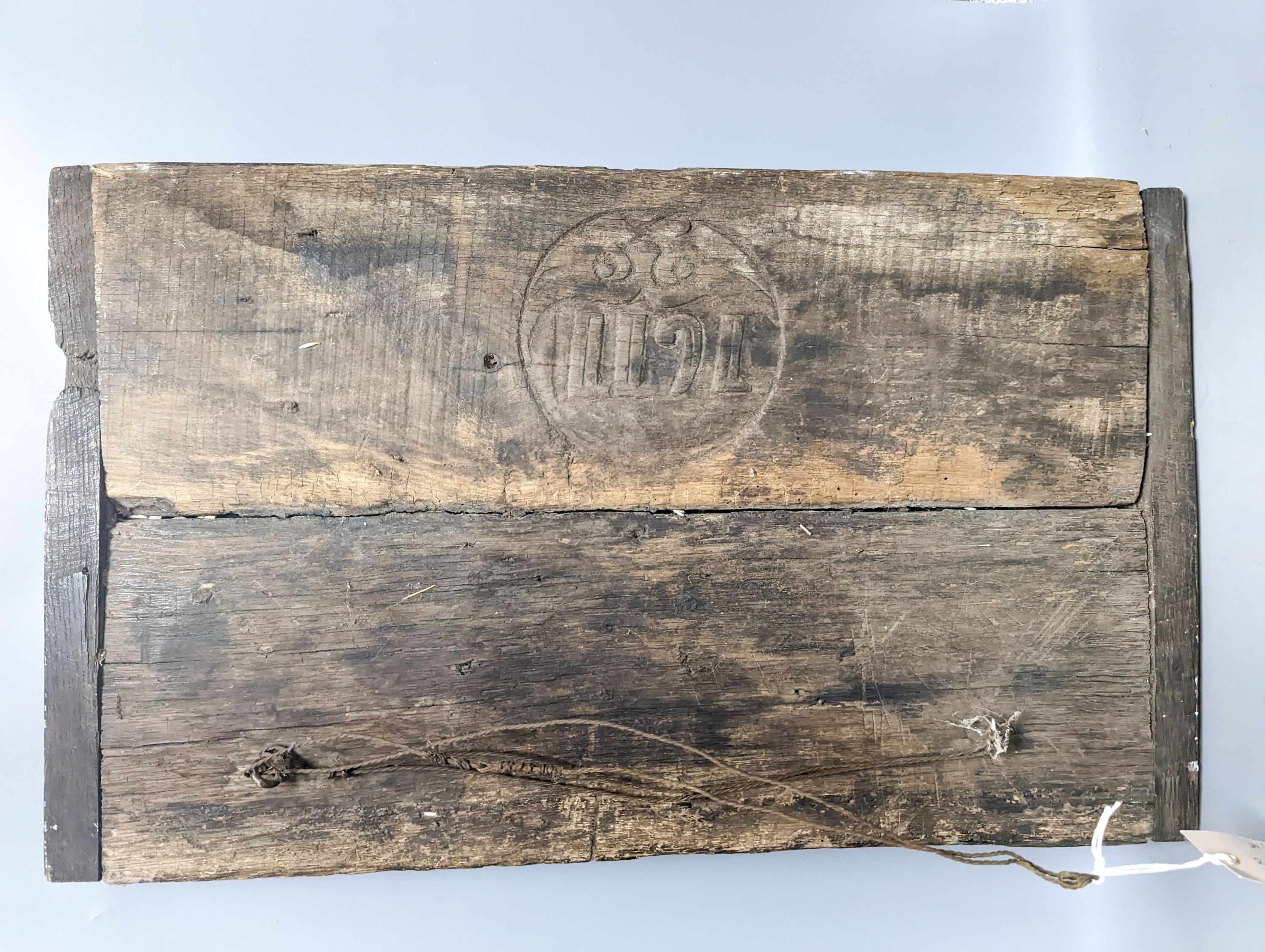 A 17th century style sunken-carved oak panel 37x61cm
